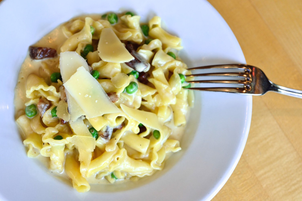 Campanella with pancetta, peas, garlic and a parmigiano cream sauce.