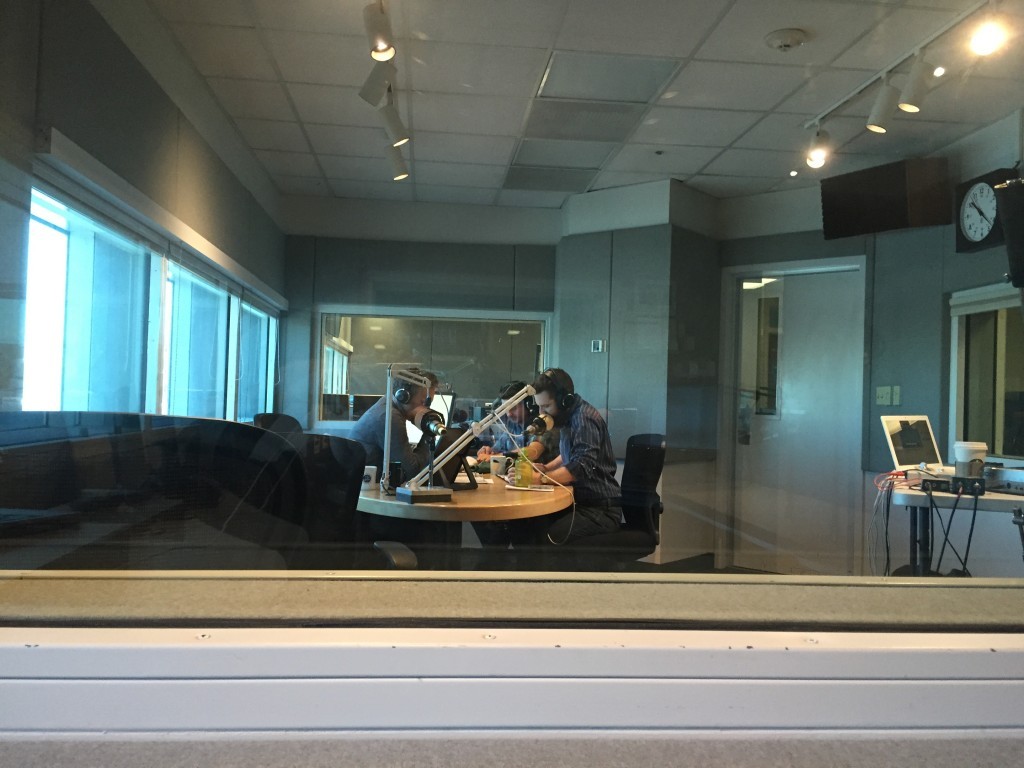 In the studio, KUER RadioWest host Doug Fabrizio with Dr. Arlen Childs (Jay Perry) in 'Otherwhere.' Photo credit: The Utah Review.